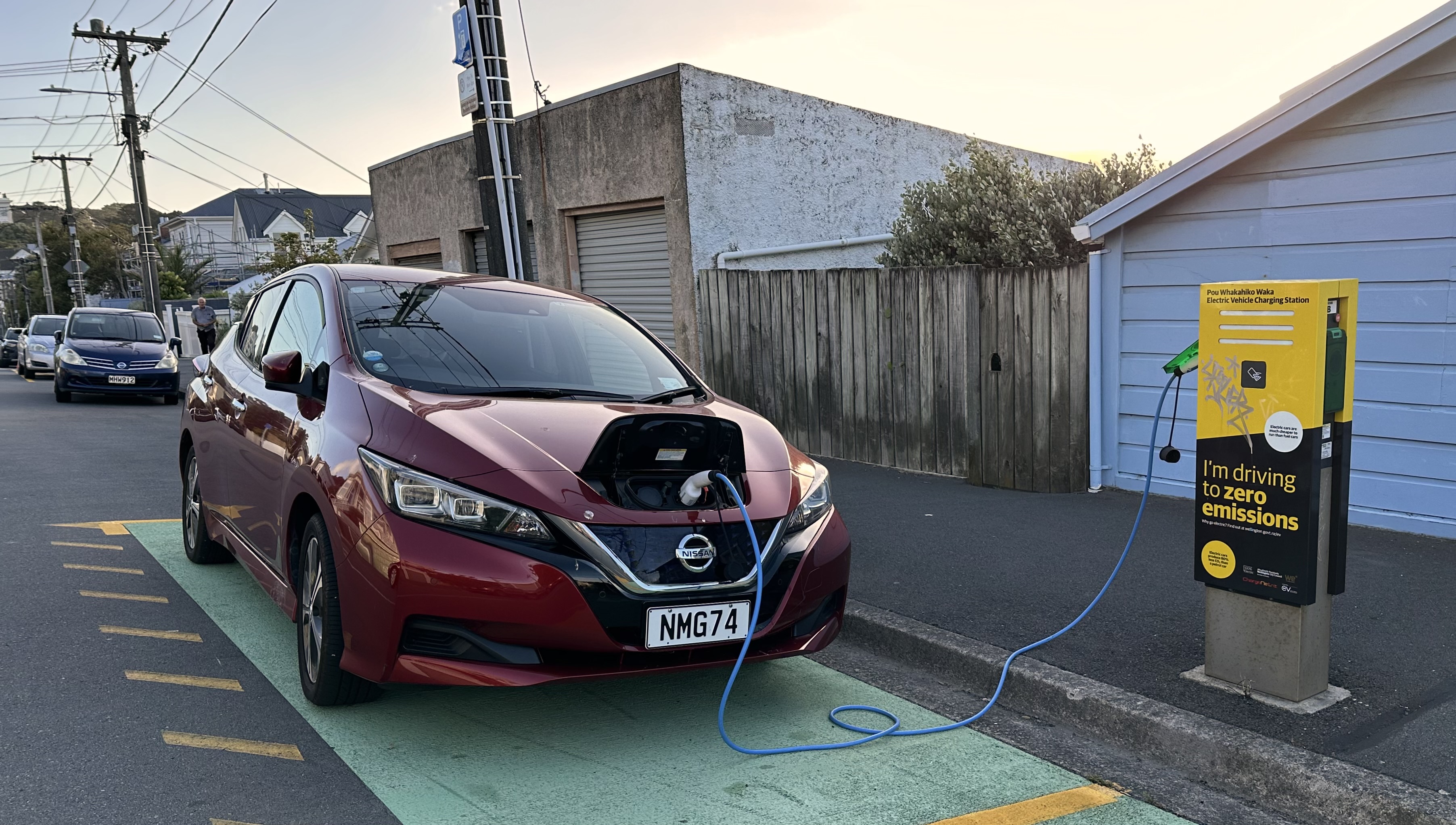 An electric vehicle charging at a public charging station in Wellington, New Zealand