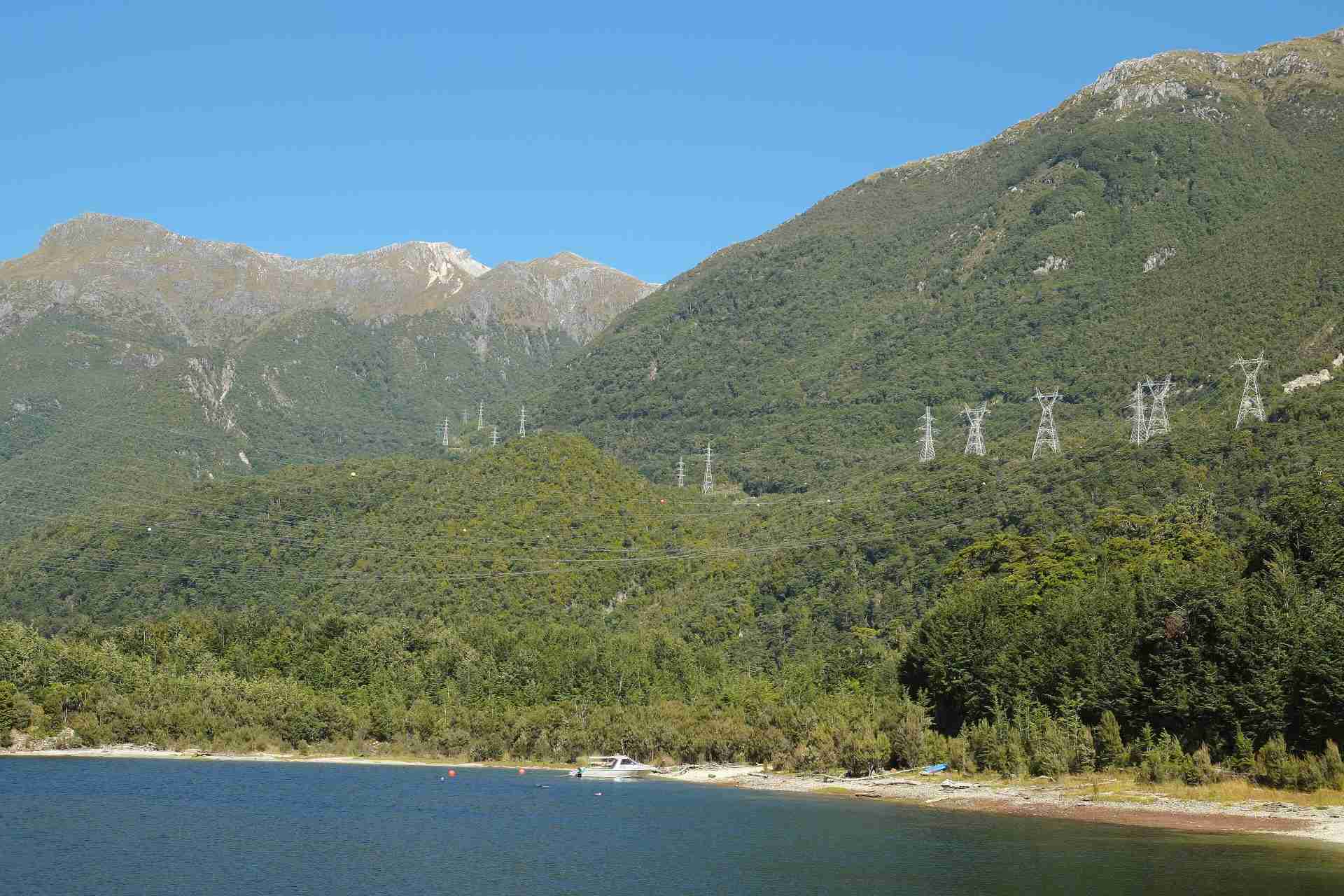 High voltage transmission lines crossing Lake Manapouri and the mountains of Fiordland, New Zealand