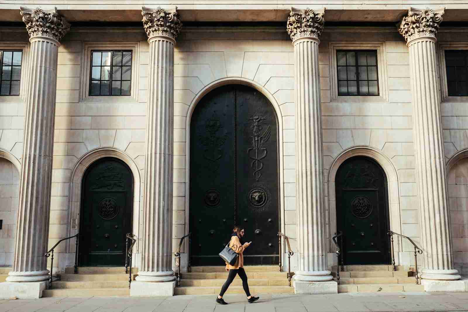 Classical bank building facade with ionic pillars — illustrating the structural advantages NZ banks enjoy