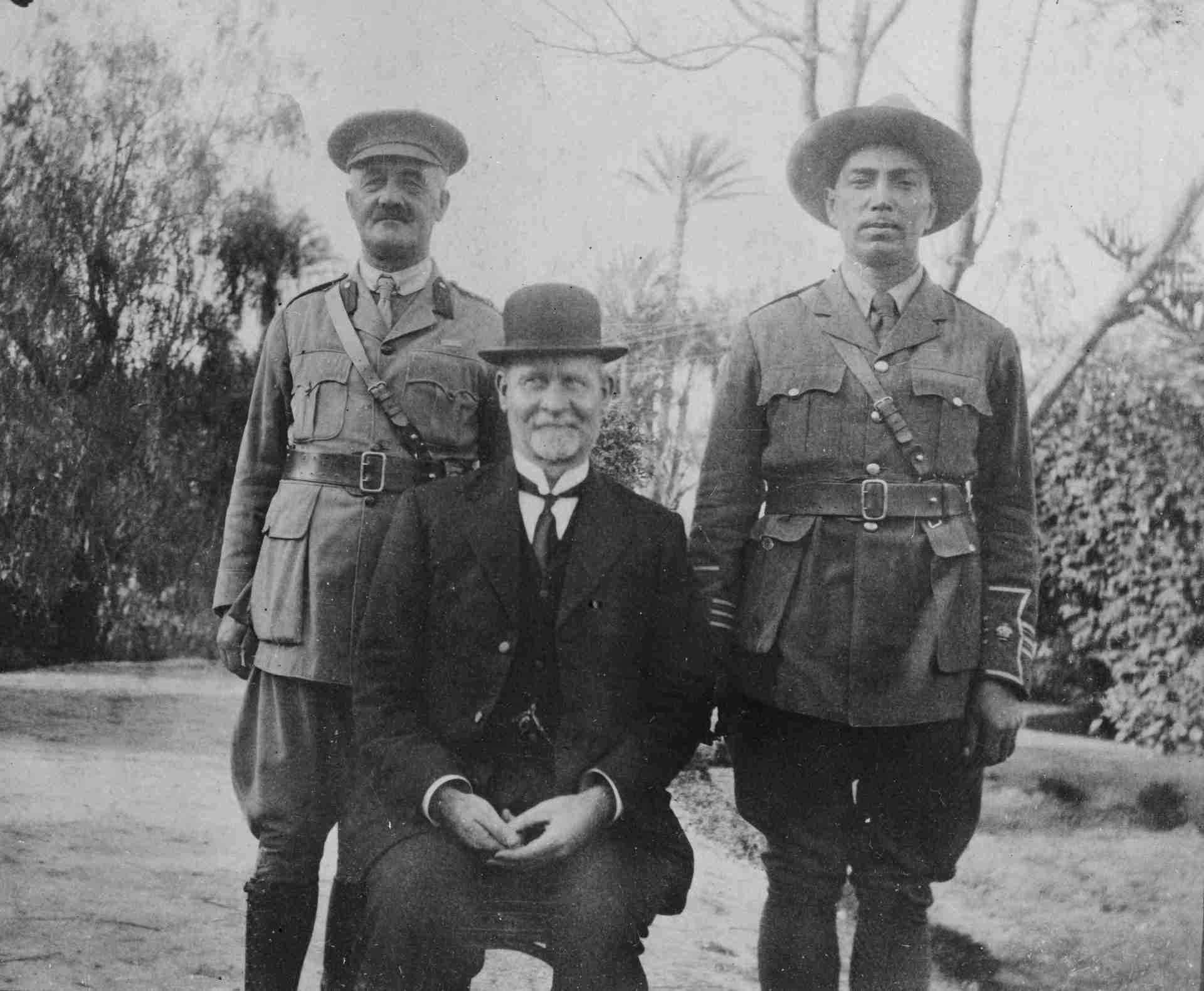 Peter Buck, at right, photographed in formal dress with two companions