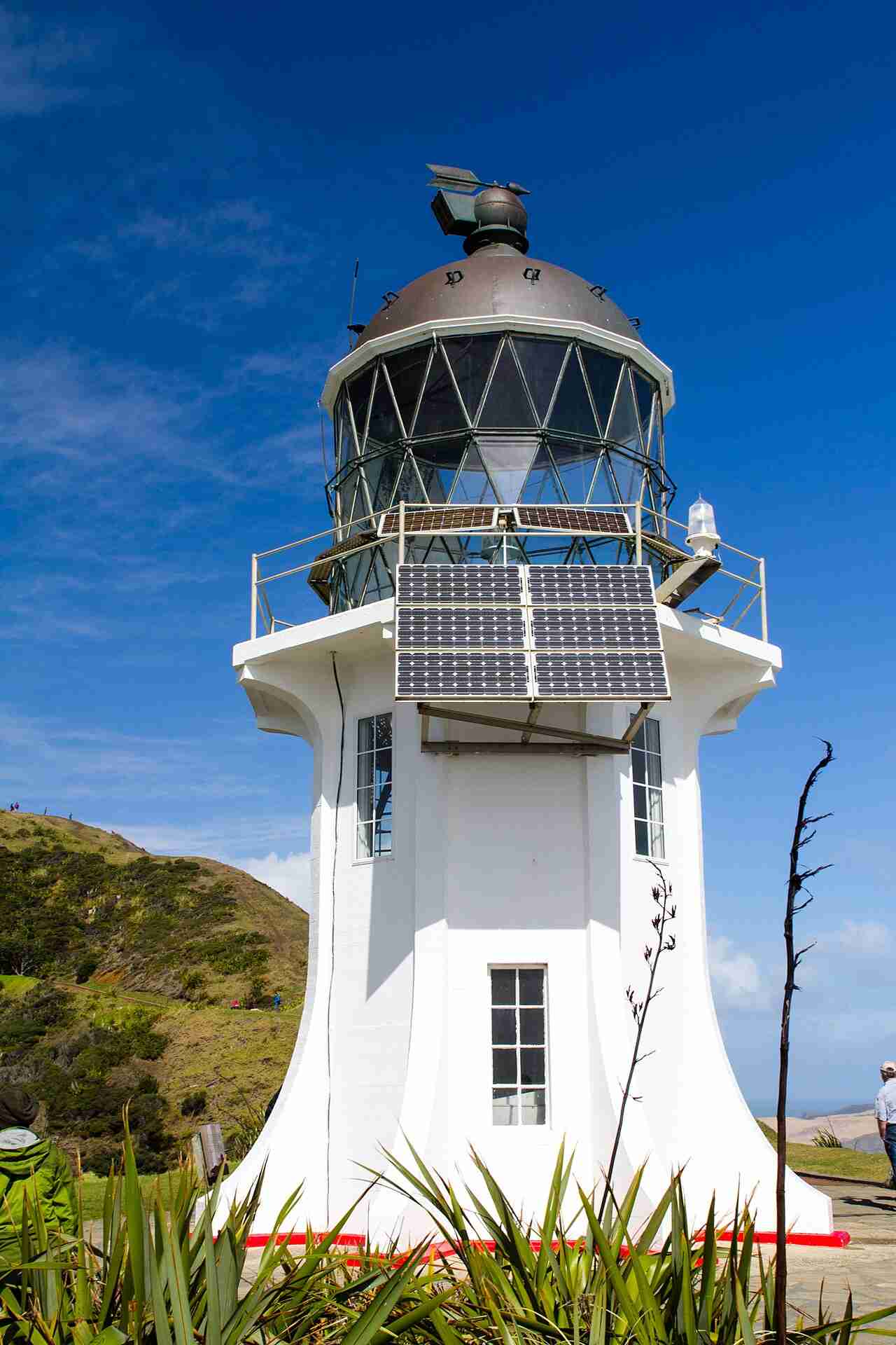 Cape Reinga Lighthouse, a white tower on the cliff at the northern tip of New Zealand